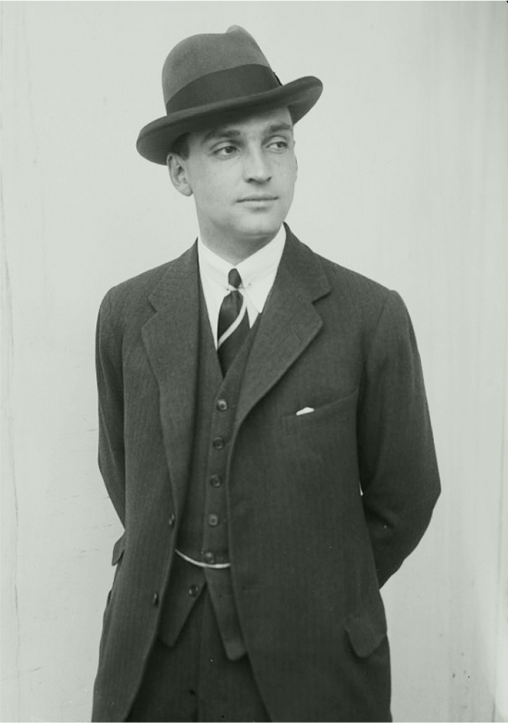 Historical portrait of Marshall Field III in formal attire with fedora